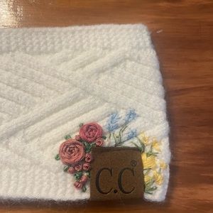 Floral hand embroidered C.C. headband. New with tags.